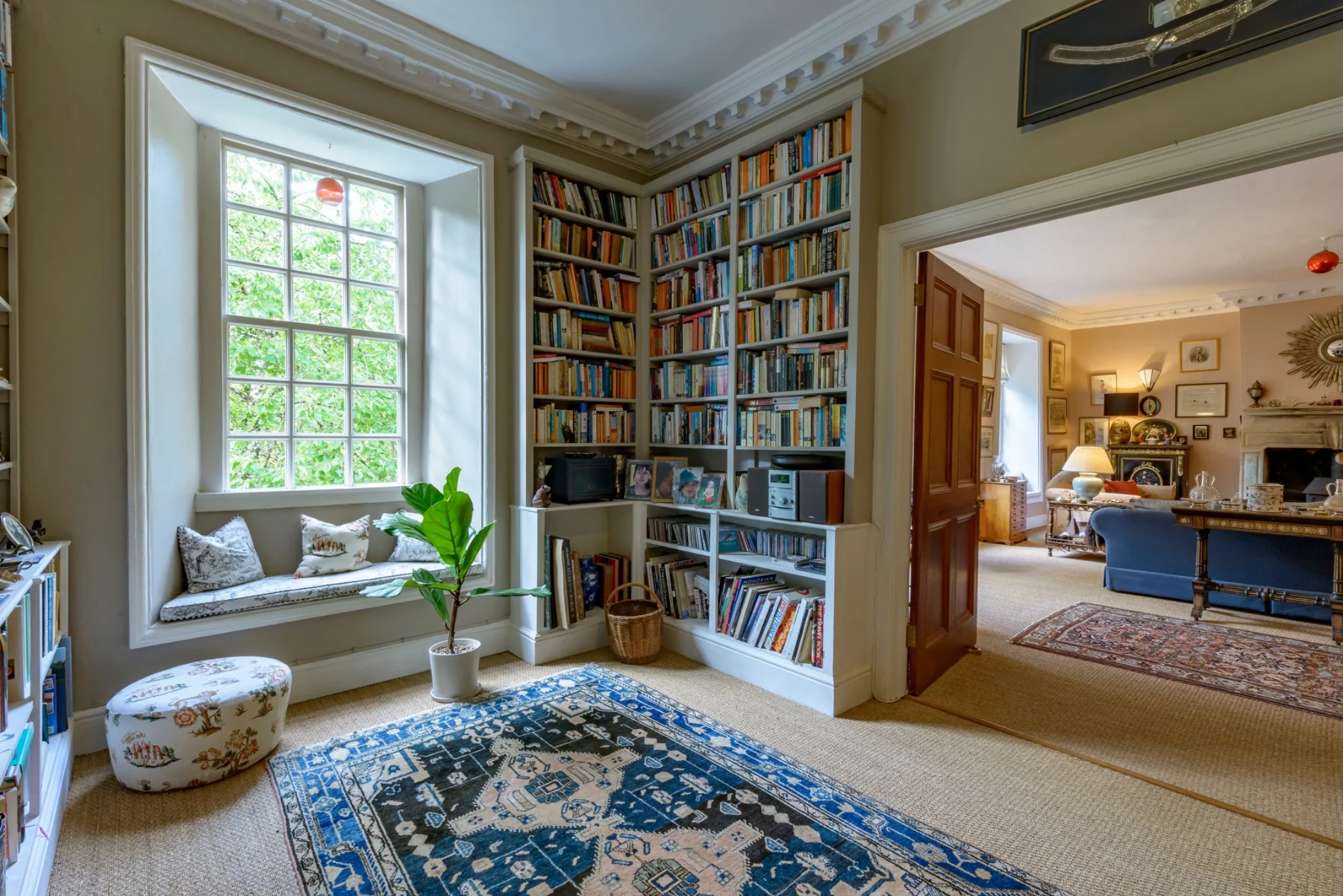 Books and a window seat beside the drawing room